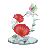 GLASS HUMMINGBIRD OVER FLOWERS